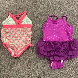 2 -One piece bathing suits 12-18 months. 1 purple & 1 pink/green. Good condition